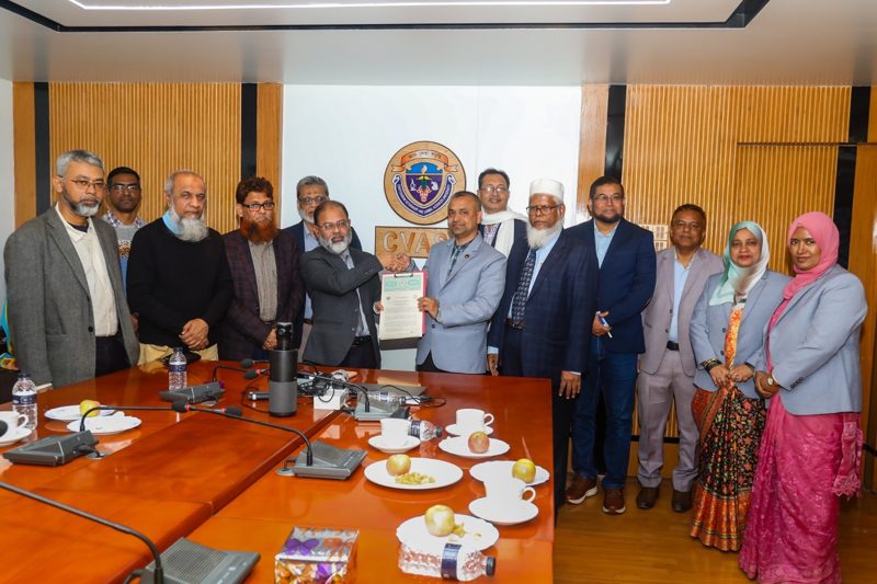 Officials exchanging a signed agreement at Chattogram Veterinary and Animal Sciences University